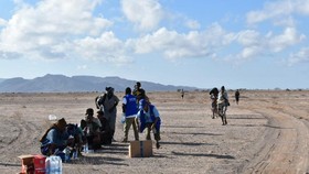 International Organization for Migration workers receive migrants after a boat carrying about 305 people capsized while sailing from Djibouti to Yemen, leaving at least 109 migrants, including 15 children, dead and more than 116 missing, according to