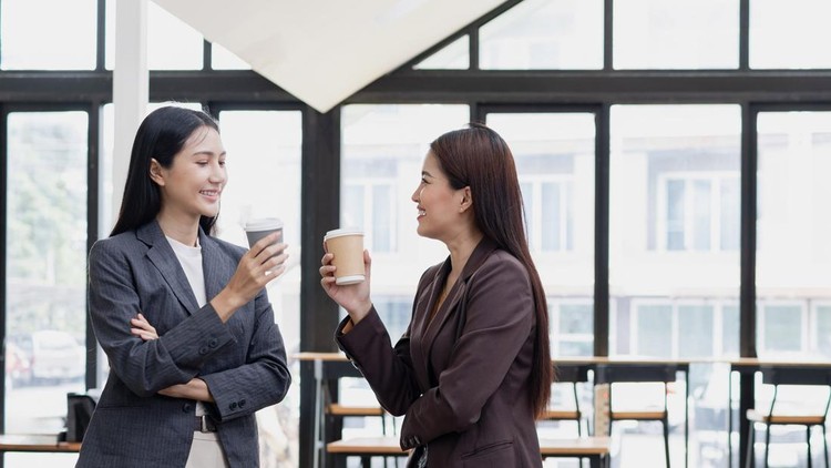 Two asian businesswoman talking about business standing in the office workspace&comma; Business and people partnership concept&period;
