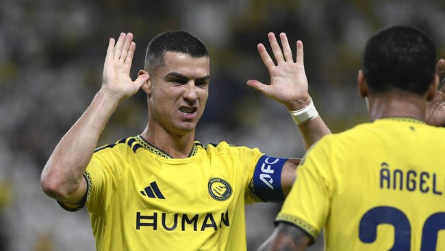 Soccer Football - AFC Champions League Elite - Al Nassr v Neftchi Fergana - Al Awwal Park, Riyadh, Saudi Arabia - October 12, 2026 Al Nassr's Angelo celebrates scoring their first goal with Cristiano Ronaldo REUTERS/Stringer