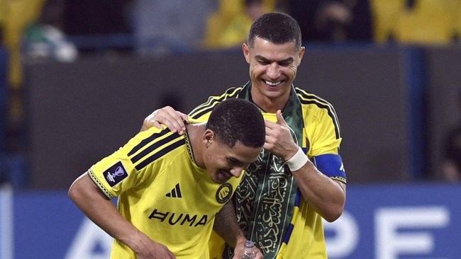 Soccer Football - AFC Champions League Elite - Al Nassr v Neftchi Fergana - Al Awwal Park, Riyadh, Saudi Arabia - October 12, 2026 Al Nassr's Cristiano Ronaldo and Angelo celebrate after the match REUTERS/Stringer
