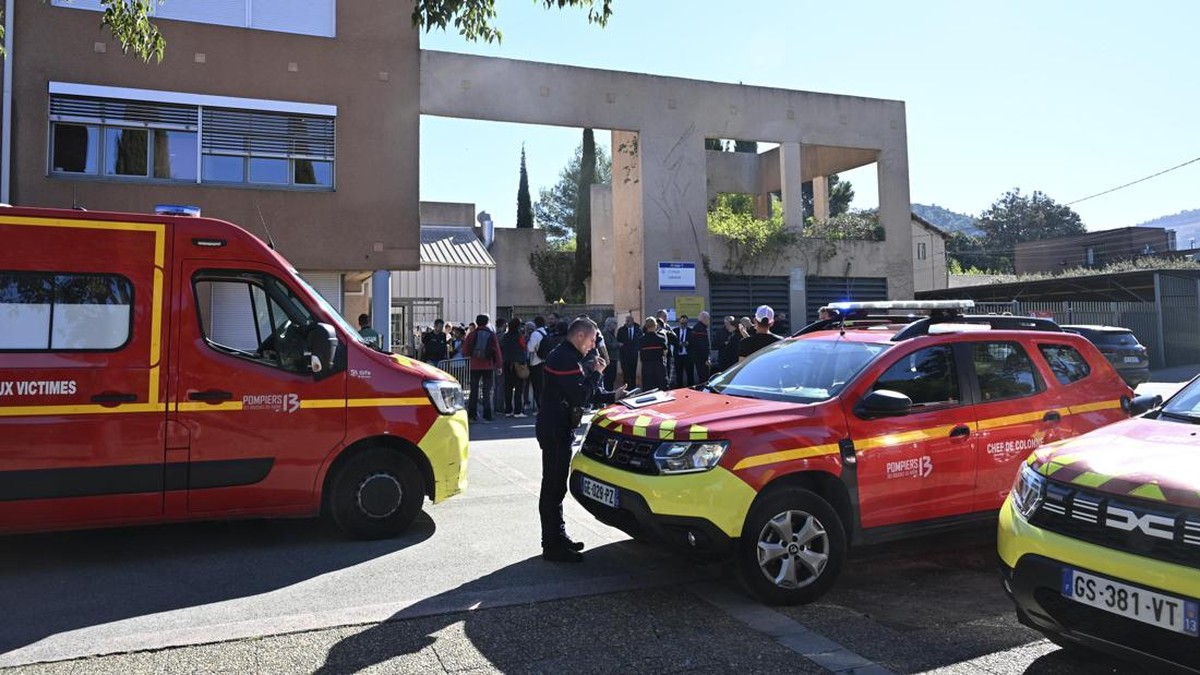 Firefighters vehicles are parked in front of Joseph-Lakanal middle school after a headmaster was injured by a hunting rifle shot and a teenager was arrested in Aubagne, southern France, on October 12, 2026. The school head was hit by a 12-gauge hunti