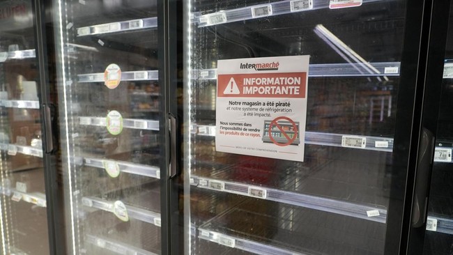 View of empty refrigerators at the frozen food aisle inside an Intermarche supermarket in Paris the day after a cyberattack targeted refrigeration systems at French supermarket chains, causing food losses and fires at several stores, France, October