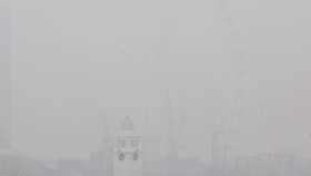 This picture provided by The Straits Times taken and received on October 14, 2026 shows the city shrouded with haze in Singapore. Air pollution in western Singapore hit the country's "very high" band on October 14, the environment agency said, as haz
