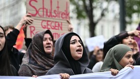 (FILES) Young protesters take part in a demonstration against a headscarf ban in schools, on October 9, 2026 in Vienna, Austria. As the new school year gets under way in Austria, a headscarf ban for girls under 14 has sparked protests on the streets