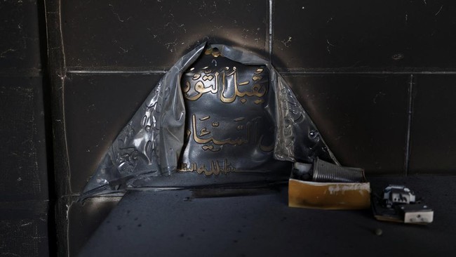 Damage inside a mosque, which Palestinians say was burned by Israeli settlers, in Mukhmas, near Ramallah in the Israeli-occupied West Bank, October 14, 2026. REUTERS/Ammar Awad