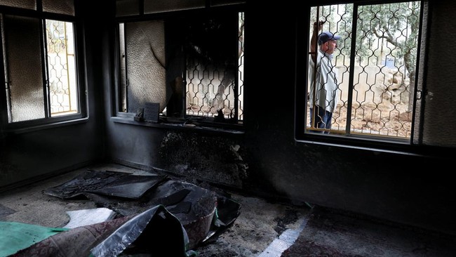 Damage inside a mosque, which Palestinians say was burned by Israeli settlers, in Mukhmas, near Ramallah in the Israeli-occupied West Bank, October 14, 2026. REUTERS/Ammar Awad