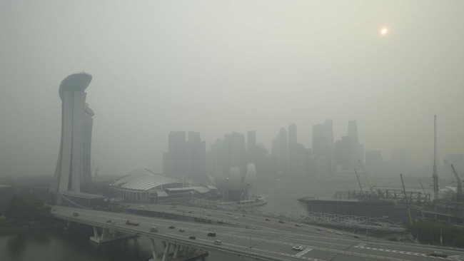 The skyline is seen in Singapore on October 15, 2026, as the country continues to be shrouded in haze caused by fires in Indonesia. Toxic haze has covered parts of Indonesia, Malaysia and Singapore for weeks as Jakarta struggles to contain fires that