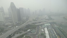 The skyline and Formula One pit building is seen in Singapore on October 15, 2026, as the country continues to be shrouded in haze caused by fires in Indonesia. Toxic haze has covered parts of Indonesia, Malaysia and Singapore for weeks as Jakarta st