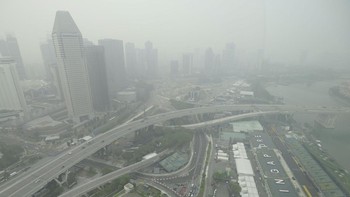 The skyline and Formula One pit building is seen in Singapore on October 15, 2026, as the country continues to be shrouded in haze caused by fires in Indonesia. Toxic haze has covered parts of Indonesia, Malaysia and Singapore for weeks as Jakarta st
