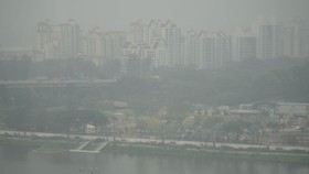 People paddle kayaks in Singapore on October 15, 2026, as the country continues to be shrouded in haze caused by fires in Indonesia. Toxic haze has covered parts of Indonesia, Malaysia and Singapore for weeks as Jakarta struggles to contain fires tha