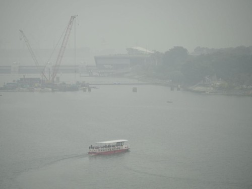 A boat is seen amid smoggy conditions in Singapore on October 15, 2026, as the country continues to be shrouded in haze caused by fires in Indonesia. Toxic haze has covered parts of Indonesia, Malaysia and Singapore for weeks as Jakarta struggles to