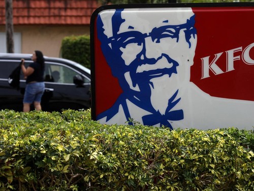 FILE PHOTO: A Kentucky Fried Chicken (KFC) logo is pictured on a sign in North Miami Beach, Florida, U.S. April 6, 2017.   REUTERS/Carlo Allegri/File Photo