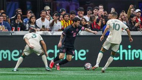 Oct 17, 2026; Atlanta, Georgia, USA;  Inter Miami CF forward Leo Messi (10) dribbles the ball against Atlanta United defender Elias Baez (3) and midfielder Miguel Almiron (10) during the first half at Mercedes-Benz Stadium.  Mandatory Credit: Jordan