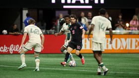 ATLANTA, GEORGIA - OCTOBER 17: Lionel Messi #10 of Inter Miami CF controls the ball whilst under pressure from Mauricio Amaro #14 and Cooper Sanchez #48 of Atlanta United FC during the MLS match between Atlanta United FC and Inter Miami CF at Mercede