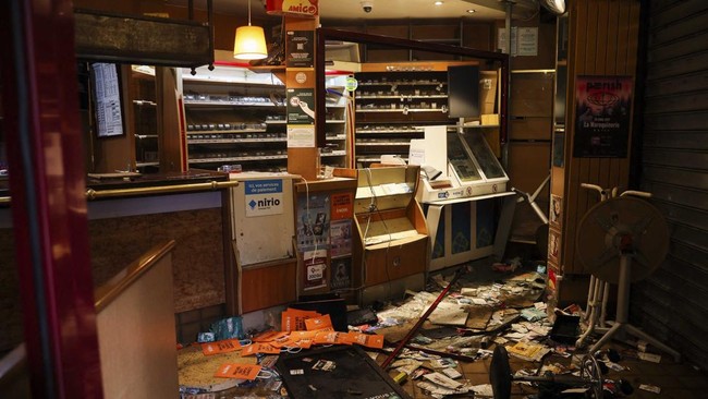 This photogaph shows a tobocco shop after being ransacked during a demonstration to protest against the