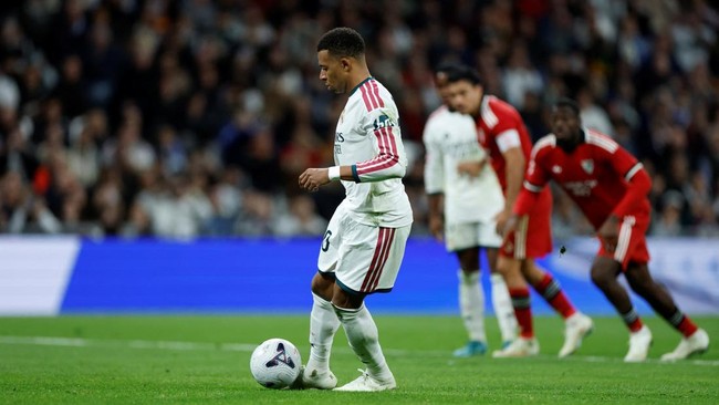 Real Madrid's French forward #10 Kylian Mbappe shoots and scores his team's third goal from the penalty spot during the Spanish league football match between Real Madrid CF and Sevilla FC at the Santiago Bernabeu stadium in Madrid on October 18, 2026
