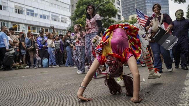 People take part in the annual zombie walk in Mexico City, Mexico, October 18, 2026. REUTERS/Toya Sarno Jordan