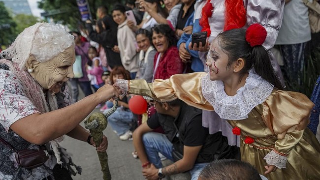 People take part in the annual zombie walk in Mexico City, Mexico, October 18, 2026. REUTERS/Toya Sarno Jordan