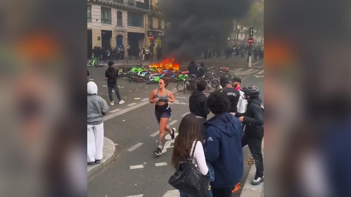 Absurd, Wanita Ini Malah Santai Jogging di Tengah Chaos Demo Prancis