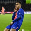 PSG's French forward #14 Desire Doue celebrates after scoring his team's first goal during the UEFA Champions League first round day 3 football match between Paris Saint-Germain (PSG) and FC Barcelona at the Parc de Princes stadium in Paris on Octobe