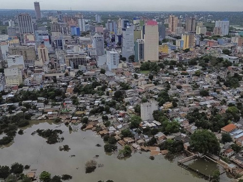 A drone view shows flooding along the Parana River after heavy rains, in Ciudad del Este, Paraguay, October 21, 2026. REUTERS/Cesar Olmedo