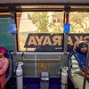 Residents receive oxygen from a free mobile oxygen bus deployed by the city government amid haze from wildfires in Palangka Raya, Central Kalimantan province, Indonesia, October 23, 2026. REUTERS/Arief Rahman Septian Prathama