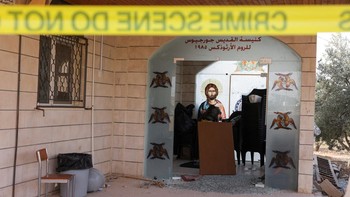 The grounds of Saint Georges Greek Orthodox Church, where gunmen opened fire during a funeral the previous day, is cordoned-off, in the village of Hamoud, Karak, Jordan, October 24, 2026. REUTERS/Alaa Al Sukhni