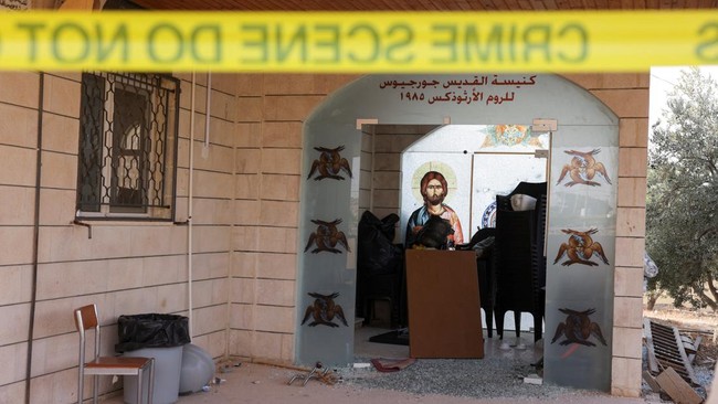 The grounds of Saint Georges Greek Orthodox Church, where gunmen opened fire during a funeral the previous day, is cordoned-off, in the village of Hamoud, Karak, Jordan, October 24, 2026. REUTERS/Alaa Al Sukhni