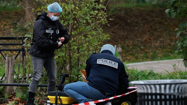 French forensic police work at the scene after a drive-by shooting that killed one person and injured several others in Trappes, in the Yvelines department, near Paris, France, October 23, 2026. REUTERS/Stephanie Lecocq
