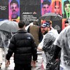 Fans walk with umbrellas and rain gear as inclement weather delays the start of the Australian MotoGP Grand Prix on Phillip Island October 25, 2026. (Photo by Paul Crock / AFP) / --IMAGE RESTRICTED TO EDITORIAL USE - STRICTLY NO COMMERCIAL USE--