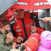 Ducati Lenovo Team's Spanish rider Marc Marquez interacts with fans as inclement weather delays the start of the Australian MotoGP Grand Prix on Phillip Island October 25, 2026. (Photo by Paul Crock / AFP) / --IMAGE RESTRICTED TO EDITORIAL USE - STRI