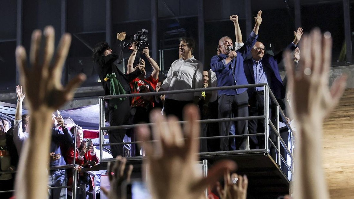 Brazil's President Luiz Inacio Lula da Silva, the Workers' Party (PT) candidate for re-election, alongside Vice President Geraldo Alckmin, gestures as he addresses supporters after his victory in the presidential runoff election, at Paulista Avenue,