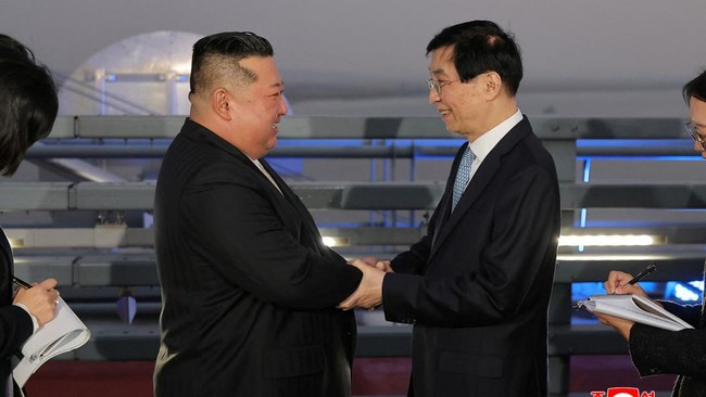 North Korean leader Kim Jong Un shakes hands with Chinese People's Political Consultative Conference (CPPCC) Chairman Wang Huning during Kim's visit to Dandong, Liaoning province, China, October 24, 2026, in this photo released by North Korea's Korea