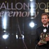 England and Bayern Munich forward Harry Kane reacts after receiving the Ballon d'Or award for the best male footballer during the 2026 Ballon d'Or France Football award ceremony at the Palladium Theatre in London on October 26, 2026. (Photo by FRANCK