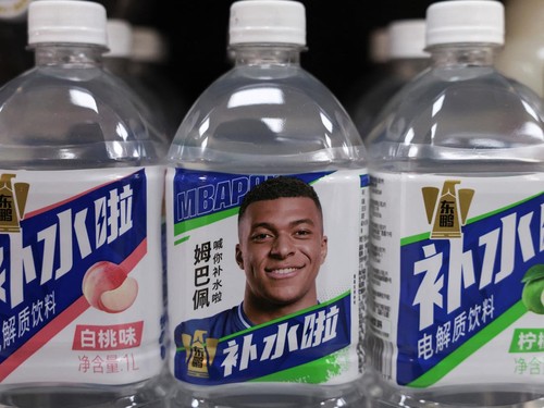Bottled drinks by Eastroc Beverage with images of French soccer player Kylian Mbappe are displayed on a shelf at a store, in Beijing, China October 27, 2026. REUTERS/Tingshu Wang