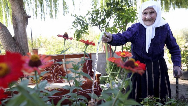 The 117-year-old Qamile Marra poses during an interview with AFP in the garden of her home in the village of Ferras, near Kucove, some 80 kilometres from the Albanian capital Tirana on October 3, 2026. At 117, Qamile Marra's priority isn't proving sh