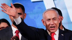 Israeli Prime Minister and Likud party leader Benjamin Netanyahu waves as he gives a statement following exit polls for Israel's national election, at Likud's election headquarters in Jerusalem, October 28, 2026. REUTERS/Ammar Awad