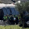 Rescue teams work at the site following the collision of two high-speed trains between the towns of Mora and Orgaz, near Toledo, Spain, October 28, 2026. REUTERS/Violeta Santos Moura